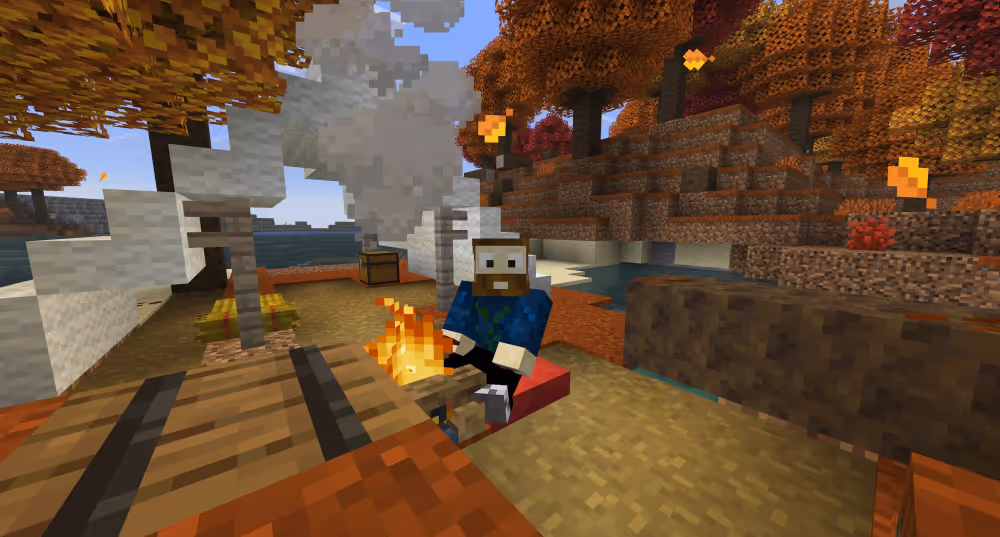 The authors Minecraft character in an abandoned campsite, sitting on a cushion beside a burning campfire.